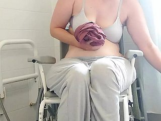 Paraplegic brunette Purplewheelz British milf peeing in a difficulty shower